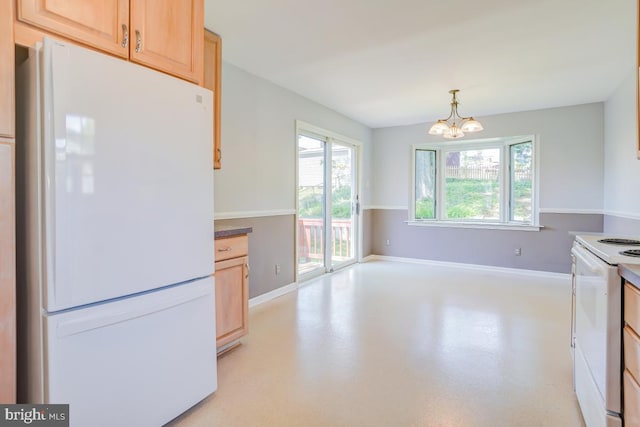 kitchen with white appliances, baseboards, a notable chandelier, and light brown cabinets
