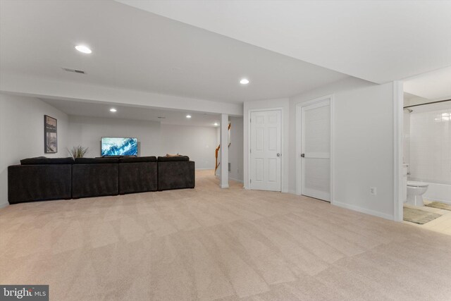 carpeted living room featuring recessed lighting, baseboards, and visible vents