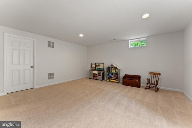 game room with light carpet and visible vents