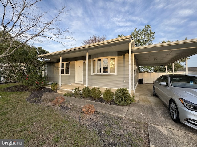 25 Bucknell Rd, Somers Point, NJ 08244 - view of front facade with an attached carport, driveway, and fence