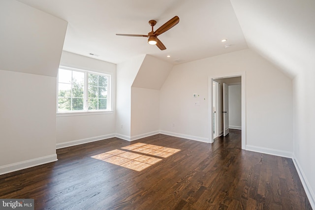 bonus room featuring a ceiling fan, visible vents, vaulted ceiling, wood finished floors, and baseboards