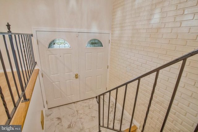 entryway with marble finish floor