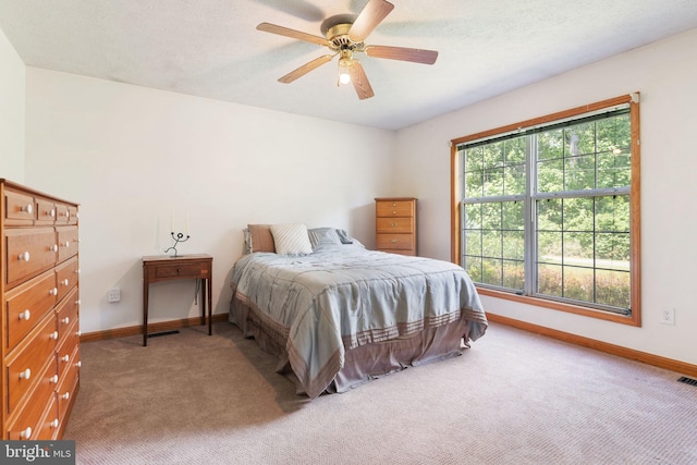 13478 Spruce, King George, VA 22485 - bedroom featuring baseboards, light carpet, a ceiling fan, and a textured ceiling