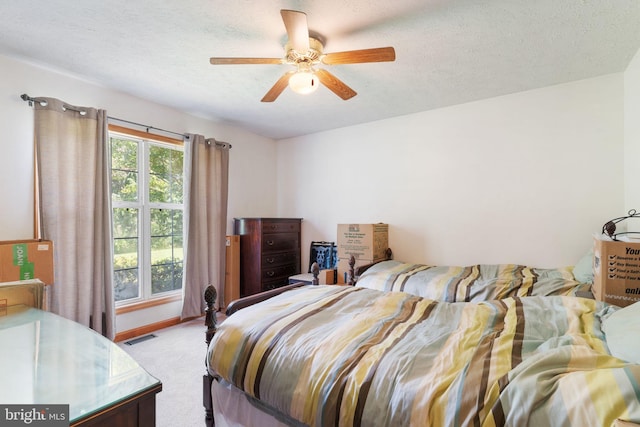 13478 Spruce, King George, VA 22485 - bedroom featuring a textured ceiling, light colored carpet, ceiling fan, and baseboards