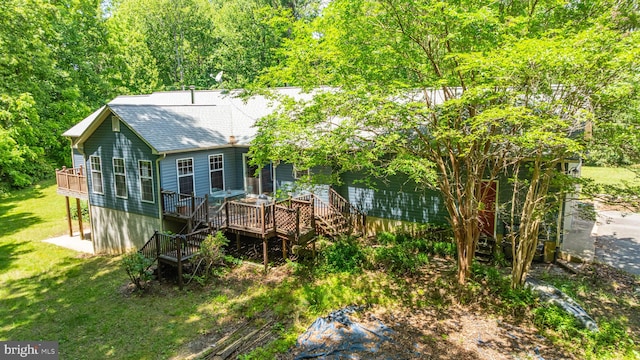 13478 Spruce, King George, VA 22485 - rear view of property with a wooden deck, roof with shingles, stairs, and a lawn