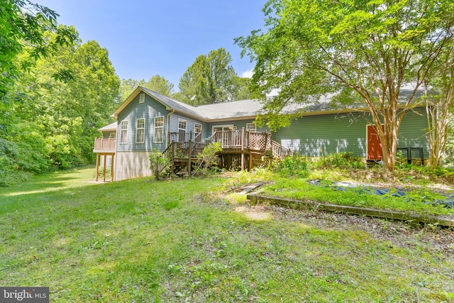 13478 Spruce, King George, VA 22485 - rear view of property with a wooden deck, a lawn, and stairs