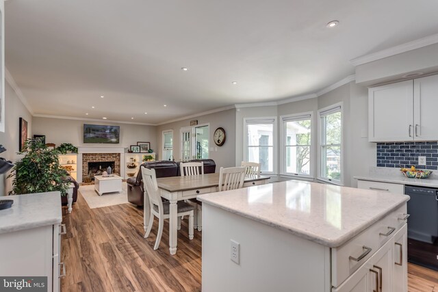 kitchen with white cabinets, plenty of natural light, and light wood finished floors