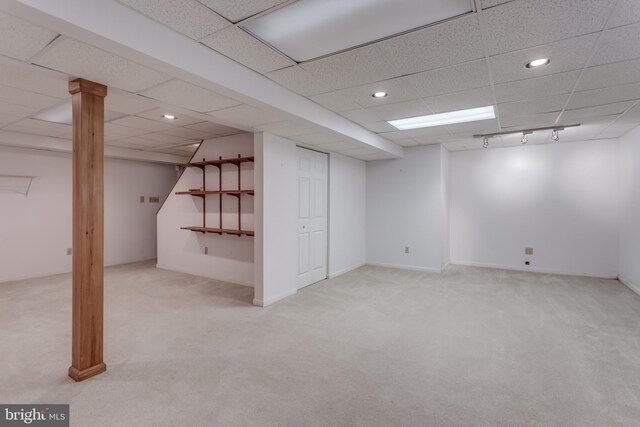 finished basement with recessed lighting, carpet flooring, and a paneled ceiling