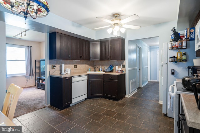 kitchen featuring decorative backsplash, a ceiling fan, visible vents, light countertops, and white appliances