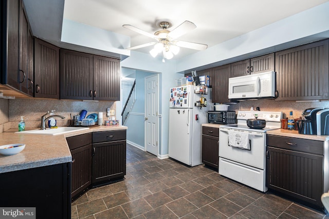 kitchen with white appliances, ceiling fan, a sink, and tasteful backsplash