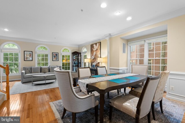 8878 Ashgrove House Ln, Vienna, VA 22182 - dining space with wainscoting, ornamental molding, and light wood-style floors