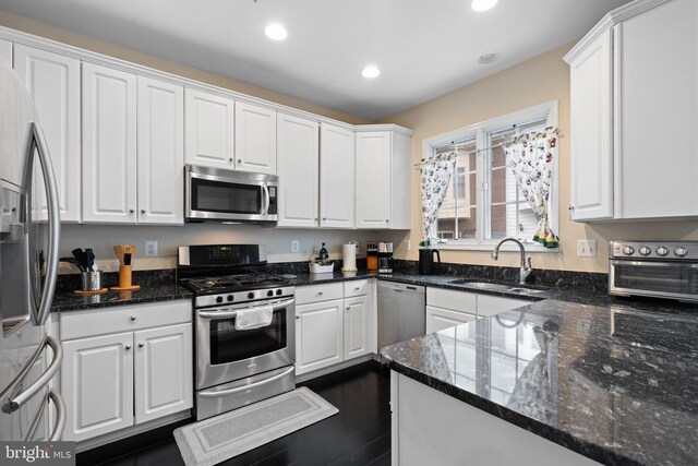 8878 Ashgrove House Ln, Vienna, VA 22182 - kitchen featuring a sink, a toaster, stainless steel appliances, white cabinetry, and recessed lighting