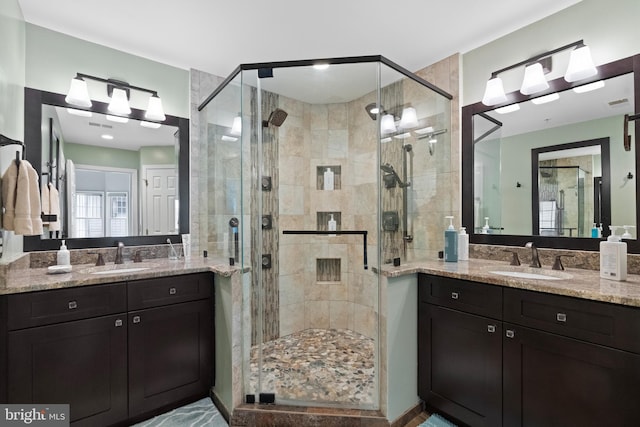 8878 Ashgrove House Ln, Vienna, VA 22182 - bathroom featuring a sink, two vanities, a shower stall, and visible vents