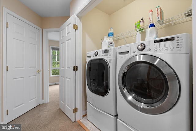 8878 Ashgrove House Ln, Vienna, VA 22182 - clothes washing area with laundry area, light colored carpet, separate washer and dryer, and baseboards