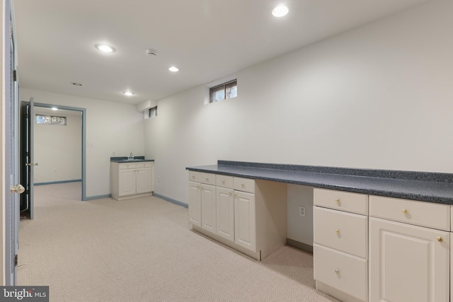 interior space featuring baseboards, recessed lighting, and light colored carpet