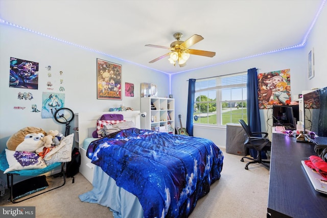 bedroom featuring carpet floors, ceiling fan, and crown molding