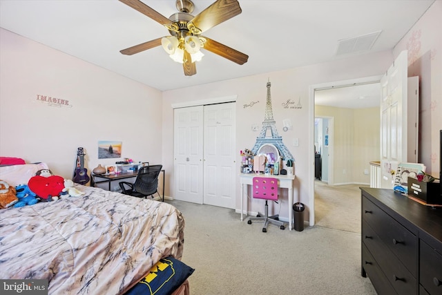 bedroom featuring visible vents, a closet, light carpet, baseboards, and a ceiling fan