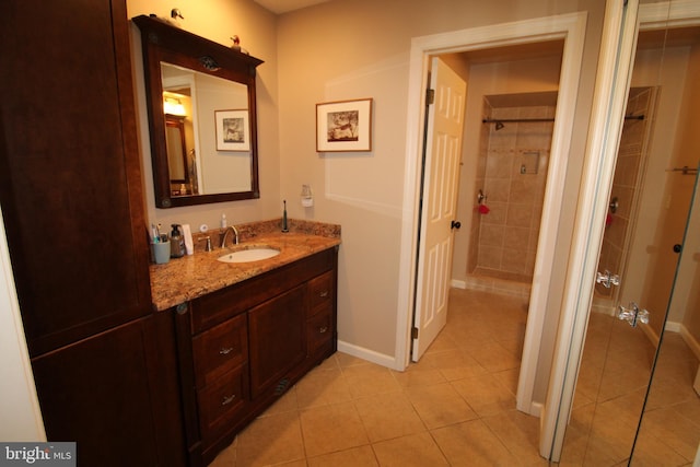 646 River Oak Ct Unit A-8Bs, Salisbury, MD 21801 - bathroom with tile patterned floors, tiled shower, baseboards, and vanity