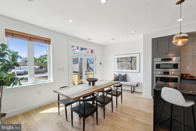 dining space featuring recessed lighting, baseboards, and light wood-style floors