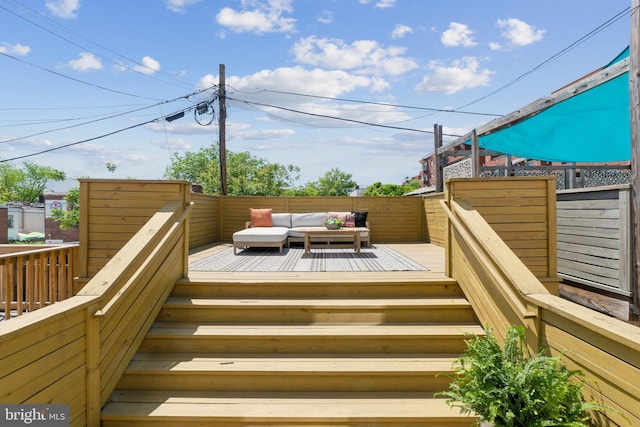 wooden deck with outdoor lounge area
