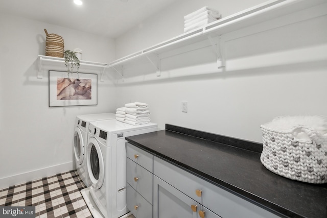 laundry area with baseboards, recessed lighting, cabinet space, and washing machine and dryer