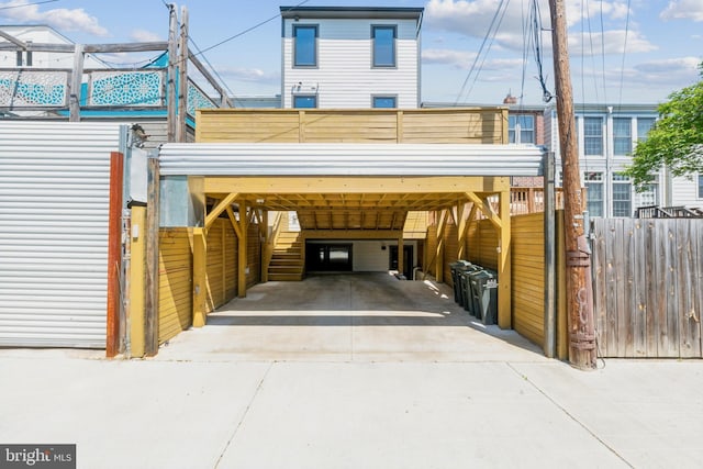 view of front facade with driveway and a carport