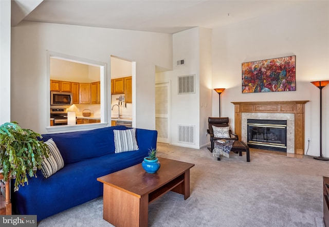 7524 Snowpea Ct Unit 9, Alexandria, VA 22306 - living area featuring a premium fireplace, light colored carpet, and visible vents