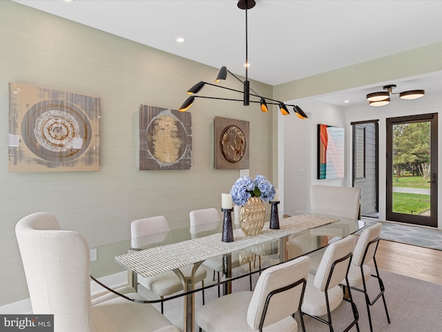dining room with recessed lighting and wood finished floors