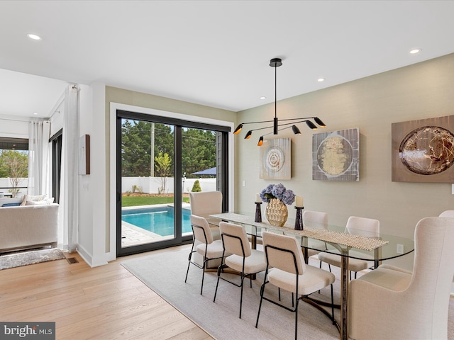 dining area featuring recessed lighting, plenty of natural light, and light wood-type flooring