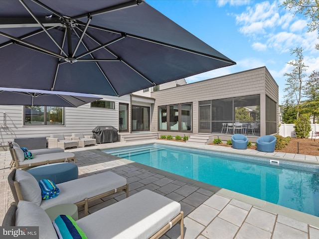 outdoor pool featuring grilling area, an outdoor living space, a sunroom, a patio, and entry steps