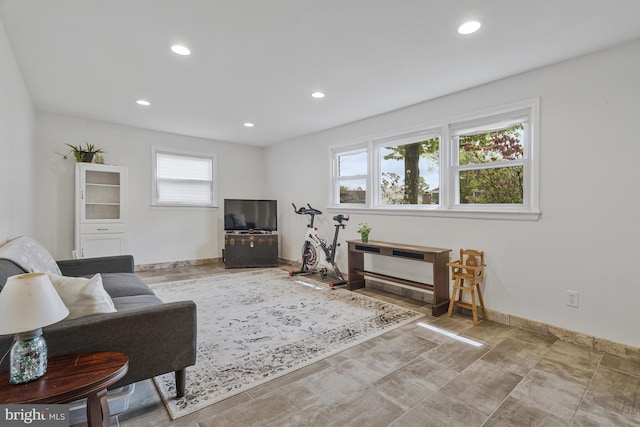 living area with recessed lighting and baseboards