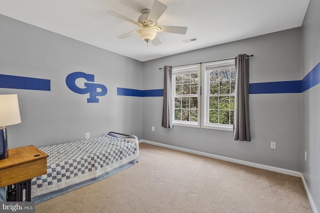 carpeted bedroom featuring a ceiling fan, baseboards, and visible vents