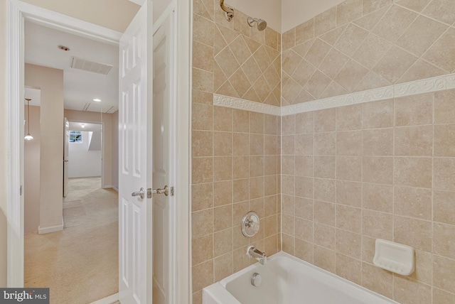 bathroom with  shower combination and visible vents