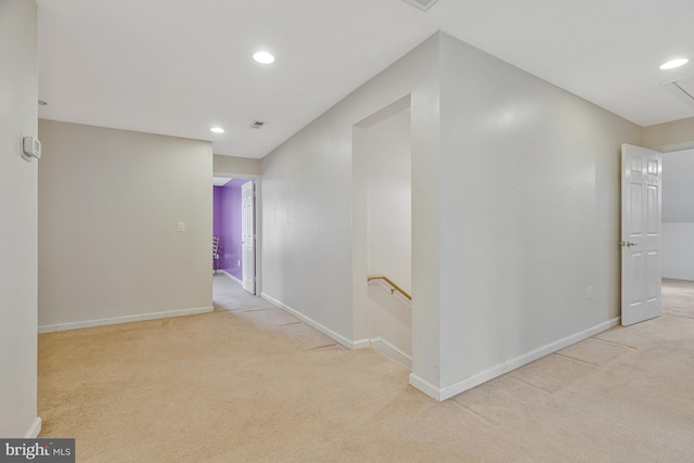 hallway with recessed lighting, carpet flooring, baseboards, and an upstairs landing