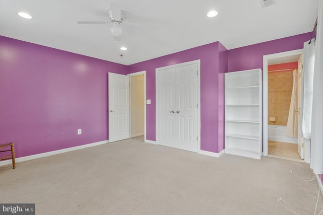 unfurnished bedroom with baseboards, carpet flooring, a ceiling fan, and a closet