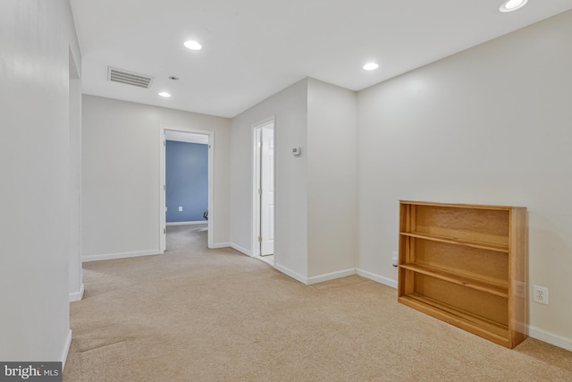 carpeted spare room with visible vents, recessed lighting, and baseboards