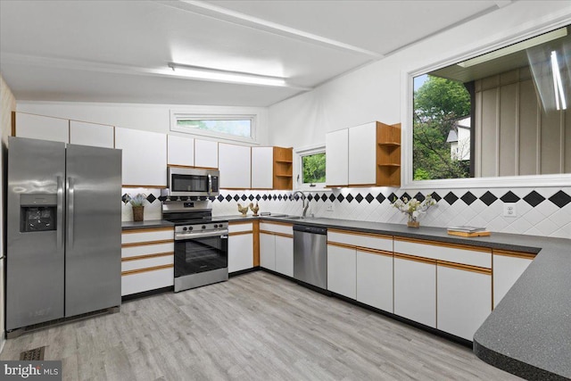11801 Cherry Grove Dr, Gaithersburg, MD 20878 - kitchen with a sink, open shelves, dark countertops, tasteful backsplash, and appliances with stainless steel finishes