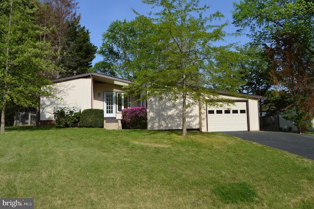 11801 Cherry Grove Dr, Gaithersburg, MD 20878 - mid-century inspired home with aphalt driveway, a front lawn, and a garage