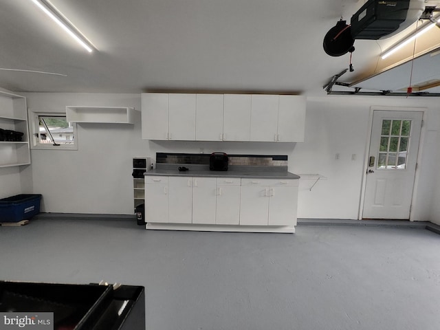 11801 Cherry Grove Dr, Gaithersburg, MD 20878 - garage featuring a garage door opener