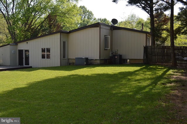 11801 Cherry Grove Dr, Gaithersburg, MD 20878 - rear view of property with a lawn, cooling unit, and fence