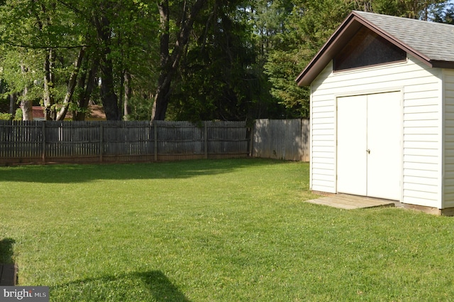 11801 Cherry Grove Dr, Gaithersburg, MD 20878 - view of yard with an outdoor structure, a shed, and a fenced backyard