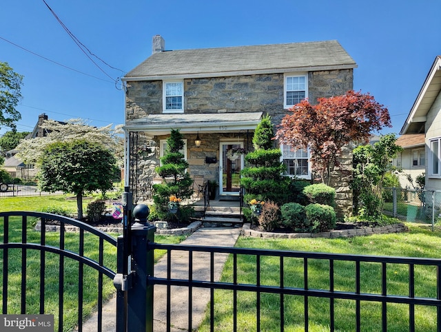 460 Burmont Rd, Drexel Hill, PA 19026 - traditional home featuring a porch, a fenced front yard, and stone siding