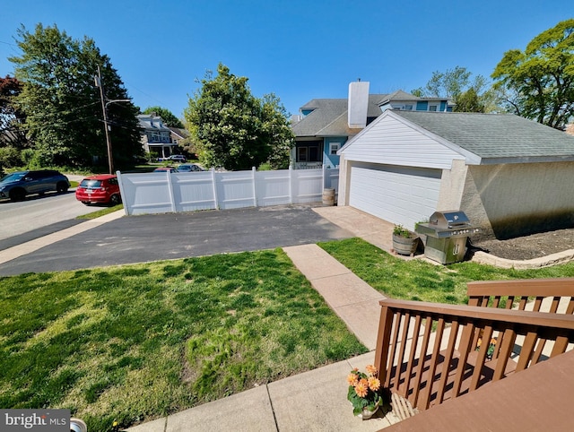 460 Burmont Rd, Drexel Hill, PA 19026 - view of home's exterior featuring a garage, fence, and a yard