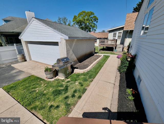 460 Burmont Rd, Drexel Hill, PA 19026 - view of side of home with a yard, fence, an outbuilding, and a detached garage