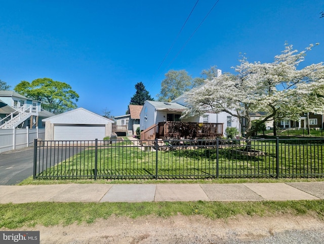 460 Burmont Rd, Drexel Hill, PA 19026 - view of front of house with fence, a detached garage, an outbuilding, and a front lawn