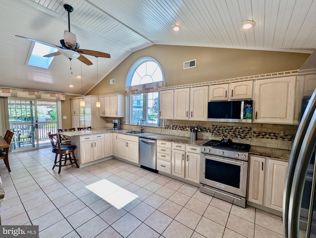 460 Burmont Rd, Drexel Hill, PA 19026 - kitchen with ceiling fan, appliances with stainless steel finishes, a sink, a peninsula, and visible vents