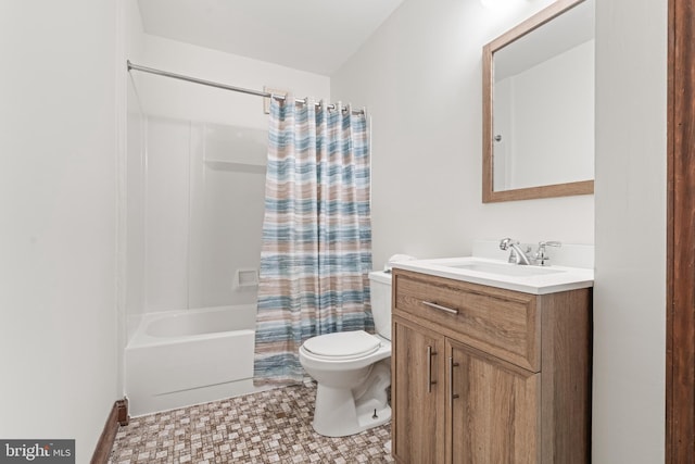 bathroom featuring toilet, shower / bath combo, and vanity