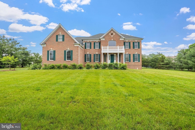 17 Grant Dr, Cream Ridge, NJ 08514 - colonial-style house featuring brick siding, a balcony, and a front yard
