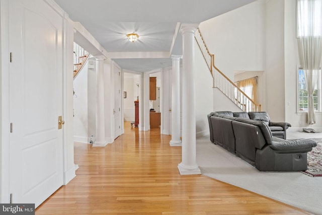 17 Grant Dr, Cream Ridge, NJ 08514 - corridor featuring stairs, decorative columns, light wood-style floors, and baseboards