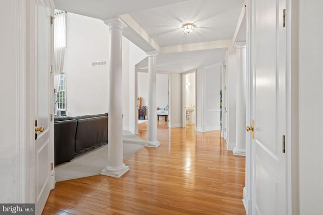 17 Grant Dr, Cream Ridge, NJ 08514 - hall with ornate columns, light wood-style floors, and baseboards